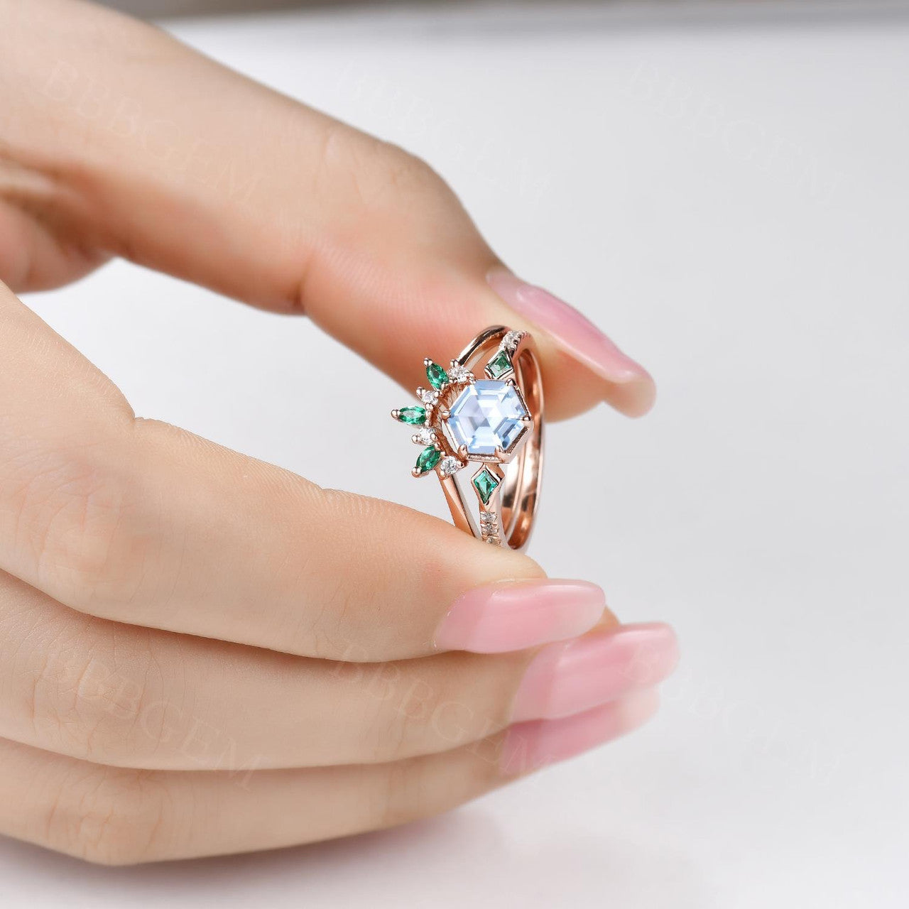 Aquamarine Hexagon Ring Bezel Set with Kite cut lab emerald side stones in rose gold