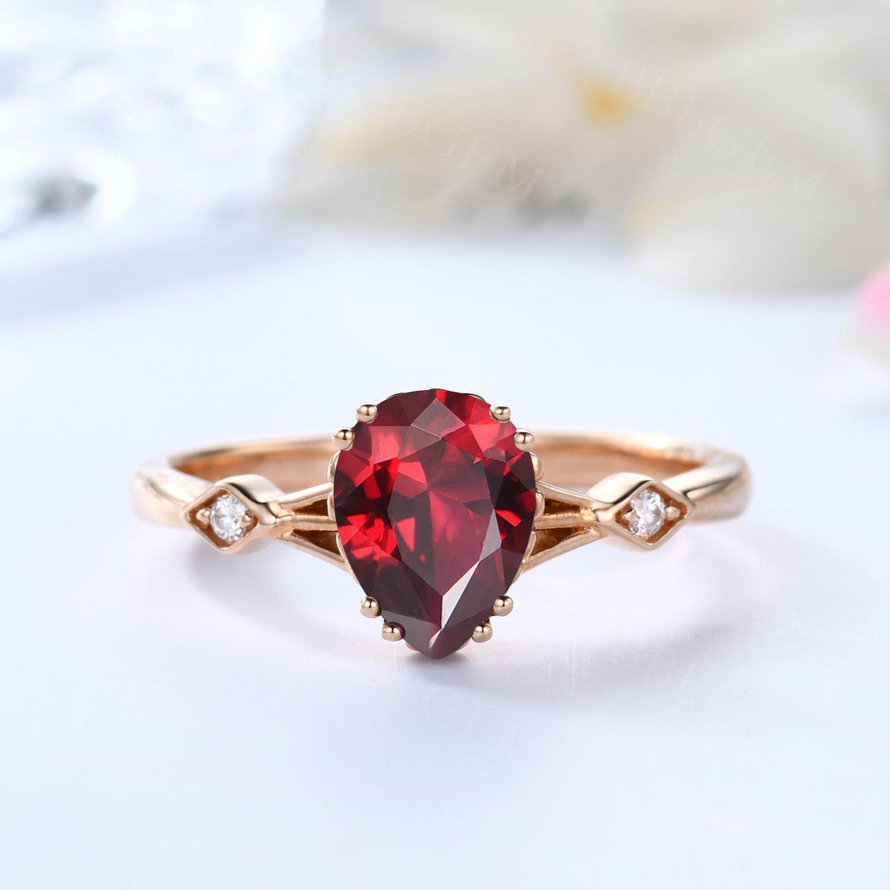 Minimalist 14K Rose Gold Three Stone Pear Shaped Garnet Engagement Ring With Square Accents