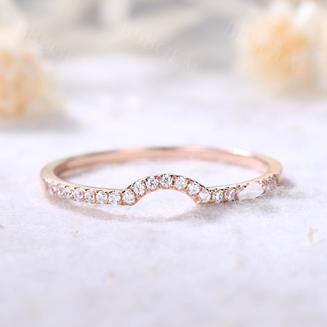 Curved diamond wedding band rose gold
