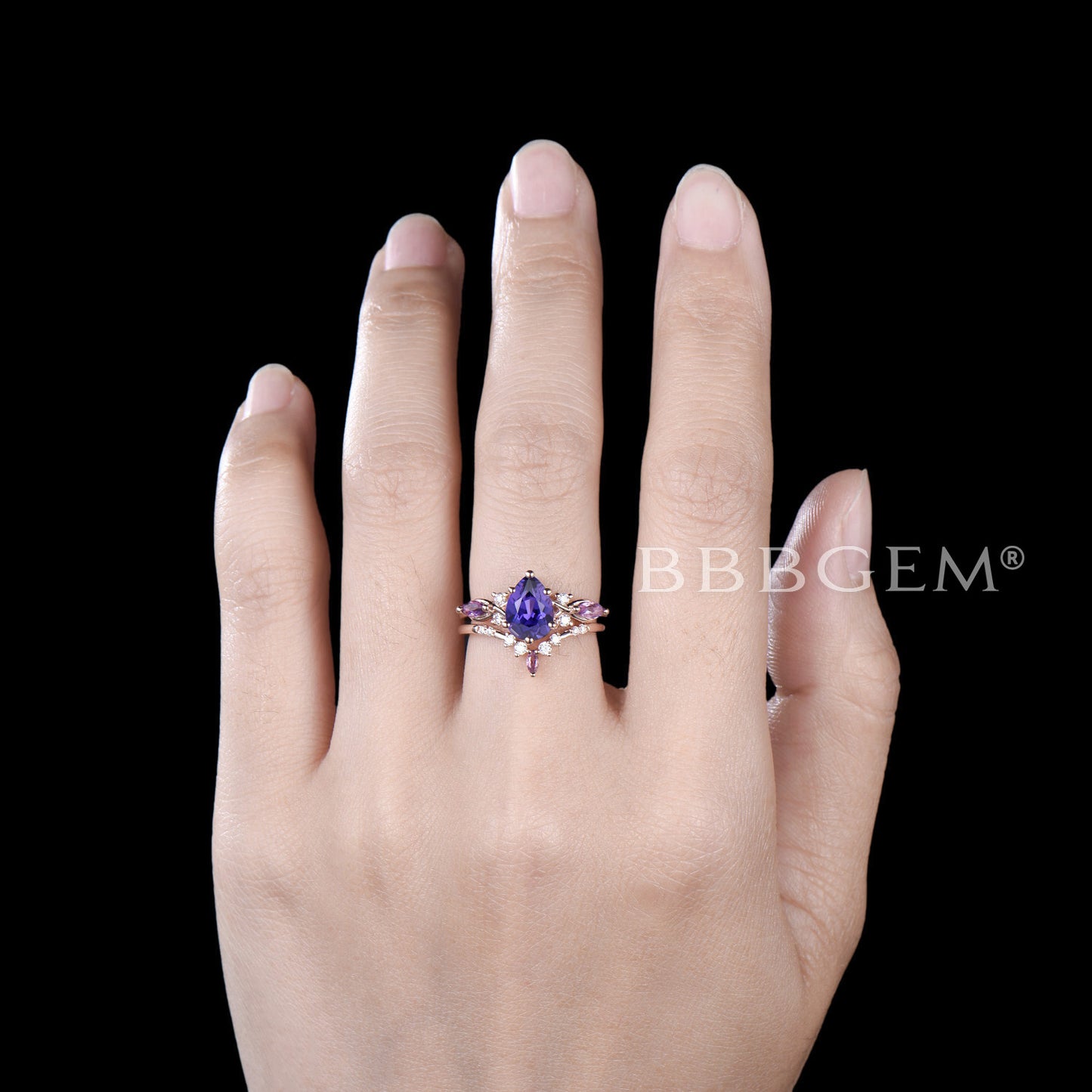 Pear Shaped Purple Sapphire Engagement Ring Twist Shank Ring