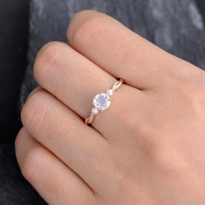 Rose Gold Moonstone And Pearl Engagement Ring  hand