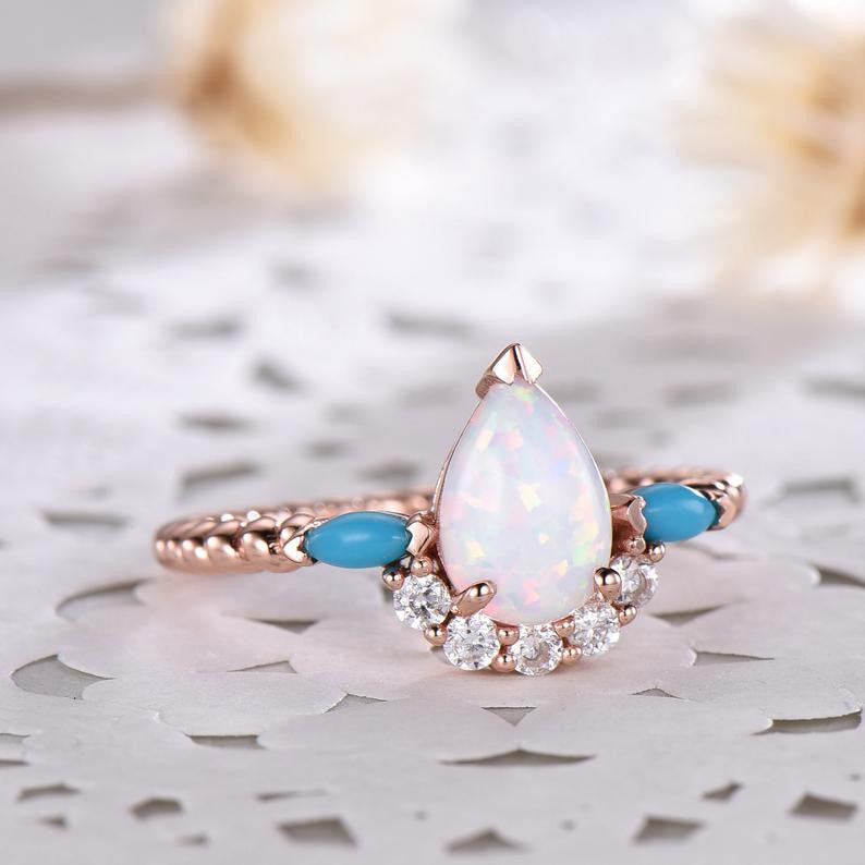 Pear shaped moonstone engagement ring and turquoise