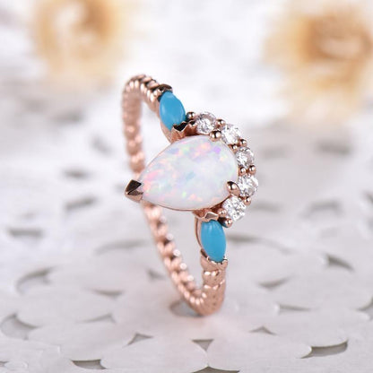 Pear shaped moonstone engagement ring and turquoise