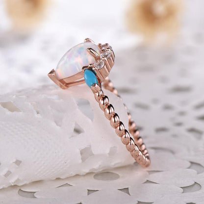 Pear shaped moonstone engagement ring and turquoise